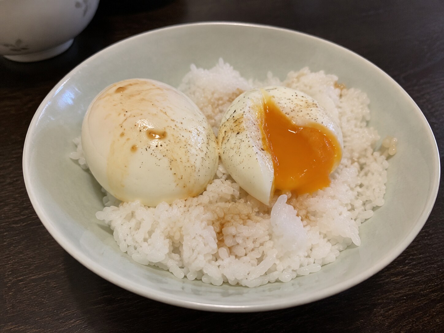 Jammy egg over rice with chili crisp and scallions