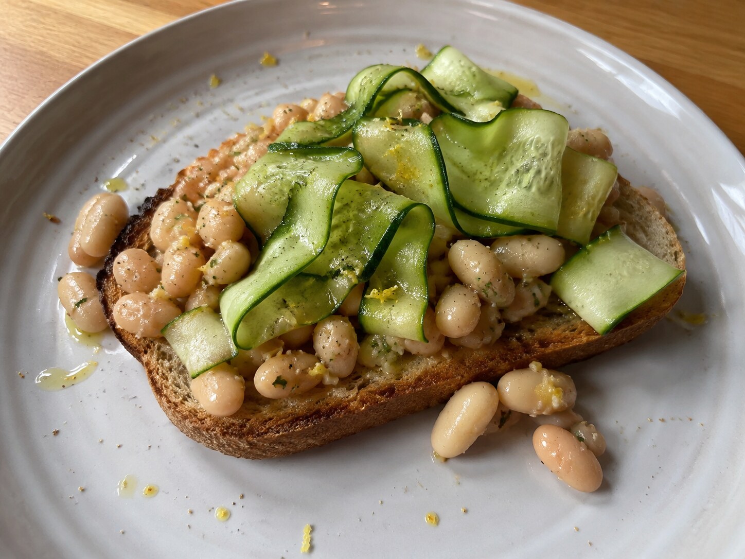 Lemony white bean toast with cucumber ribbons and dill